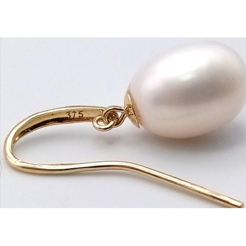 474 - A Pair of 9K Yellow Gold Pearl Earrings. 4.03g total weight.