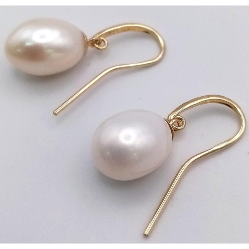 474 - A Pair of 9K Yellow Gold Pearl Earrings. 4.03g total weight.