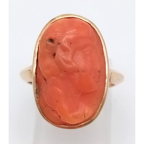 71 - A 9K ROSE GOLD RING WITH NATURAL CORAL CENTRE STONE . 4.9gms   size M