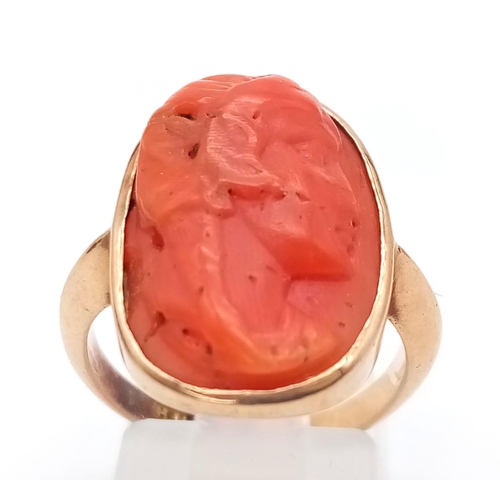 71 - A 9K ROSE GOLD RING WITH NATURAL CORAL CENTRE STONE . 4.9gms   size M