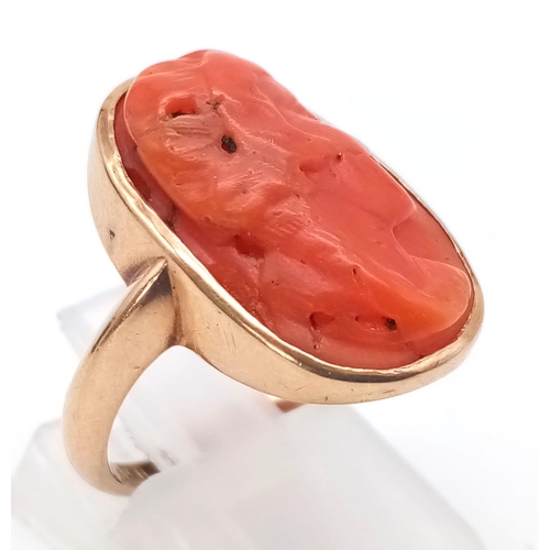 71 - A 9K ROSE GOLD RING WITH NATURAL CORAL CENTRE STONE . 4.9gms   size M