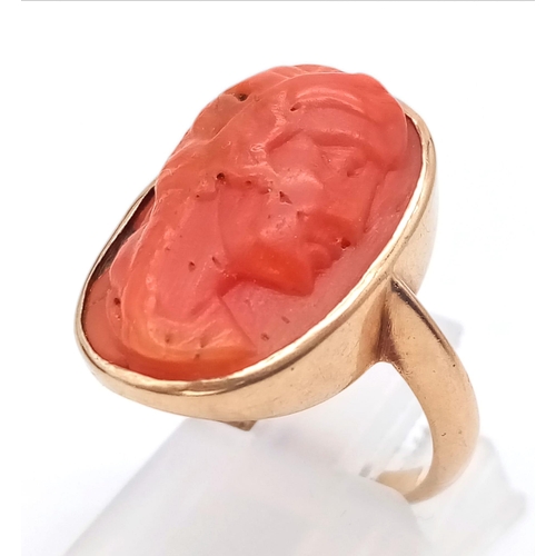 71 - A 9K ROSE GOLD RING WITH NATURAL CORAL CENTRE STONE . 4.9gms   size M