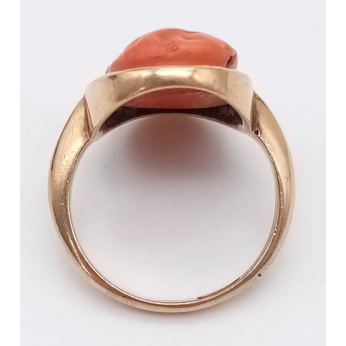 71 - A 9K ROSE GOLD RING WITH NATURAL CORAL CENTRE STONE . 4.9gms   size M