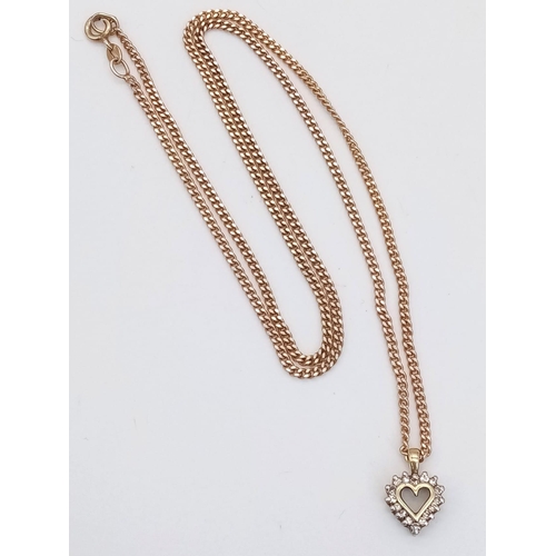 22 - A 52cms 9K GOLD CHAIN WITH A 9K GOLD AND DIAMOND HEART PENDANT .  7.9gms