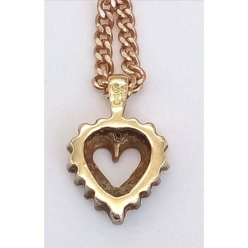 22 - A 52cms 9K GOLD CHAIN WITH A 9K GOLD AND DIAMOND HEART PENDANT .  7.9gms