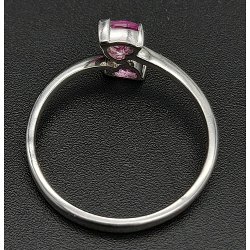 282 - A 9K White Gold Ring with Crossover Pink Topaz Gemstone Hearts. Size N 1/2. 1.65g total weight.