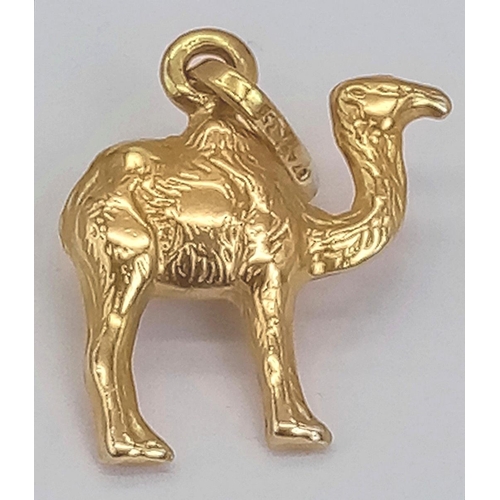 338 - AN 18K GOLD SHIP OF THE DESERT (CAMEL) CHARM .  1.5gms