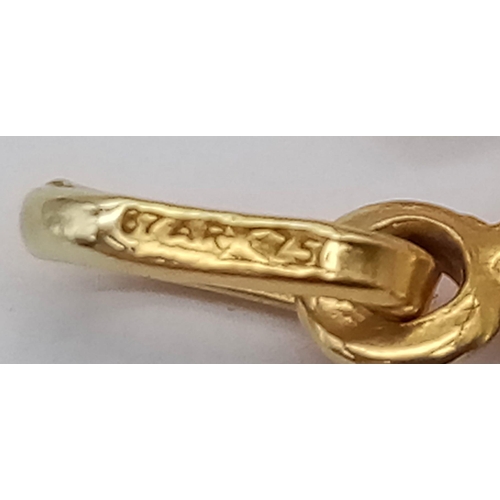 338 - AN 18K GOLD SHIP OF THE DESERT (CAMEL) CHARM .  1.5gms