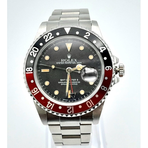 36 - A ROLEX GMT-MASTER II IN STAINLESS STEEL WITH DATE BOX, BLACK DIAL AND RED AND BLACK ROTATING BEZEL.... 