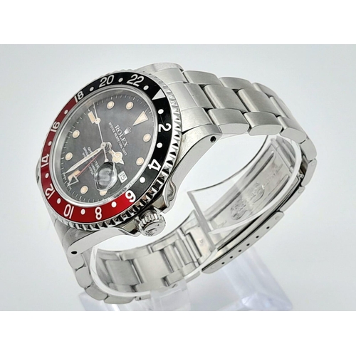 36 - A ROLEX GMT-MASTER II IN STAINLESS STEEL WITH DATE BOX, BLACK DIAL AND RED AND BLACK ROTATING BEZEL.... 