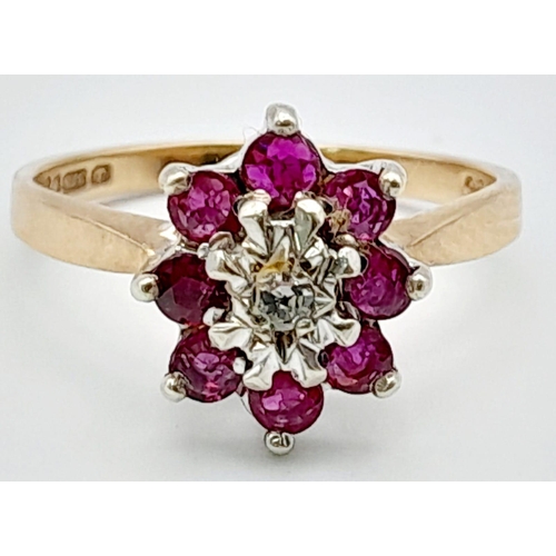 448 - 9K YELLOW GOLD DIAMOND & RUBY CLUSTER RING. TOTAL WEIGHT 3.1G.  SIZE P