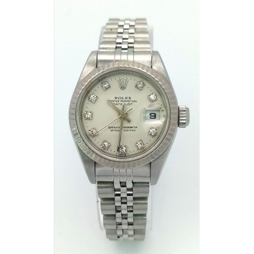 64 - A LADIES STAINLESS STEEL ROLEX OYSTER PERPETUAL DATEJUST WITH DIAMOND NUMERALS ON A WHITE FACE.  26m... 