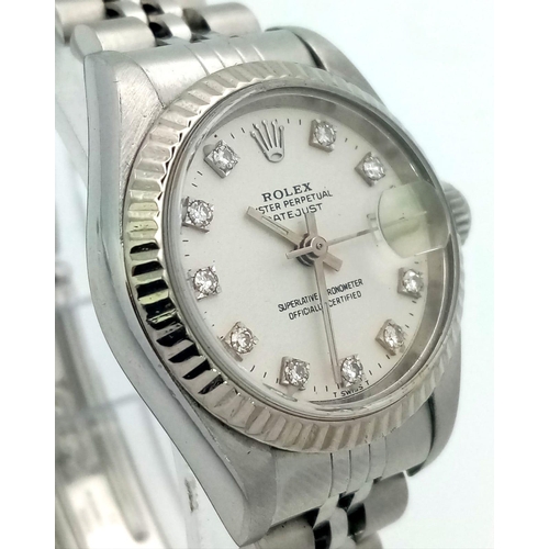 64 - A LADIES STAINLESS STEEL ROLEX OYSTER PERPETUAL DATEJUST WITH DIAMOND NUMERALS ON A WHITE FACE.  26m... 