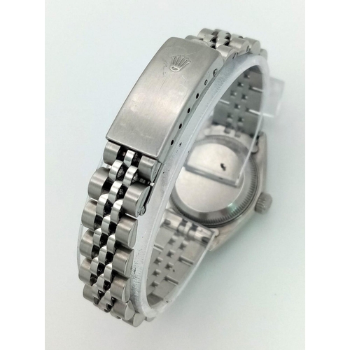 64 - A LADIES STAINLESS STEEL ROLEX OYSTER PERPETUAL DATEJUST WITH DIAMOND NUMERALS ON A WHITE FACE.  26m... 