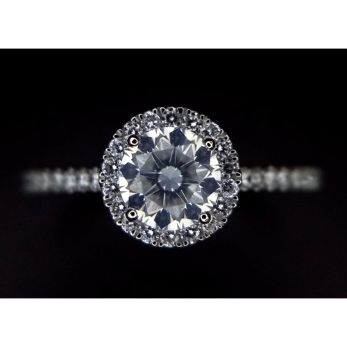 190 - A 950 Platinum Diamond Ring. 0.60ct central round brilliant diamond - D - colour, VVS1. A further 0.... 