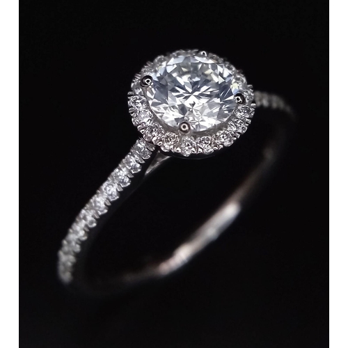 190 - A 950 Platinum Diamond Ring. 0.60ct central round brilliant diamond - D - colour, VVS1. A further 0.... 