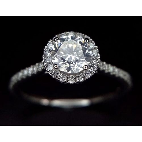 190 - A 950 Platinum Diamond Ring. 0.60ct central round brilliant diamond - D - colour, VVS1. A further 0.... 