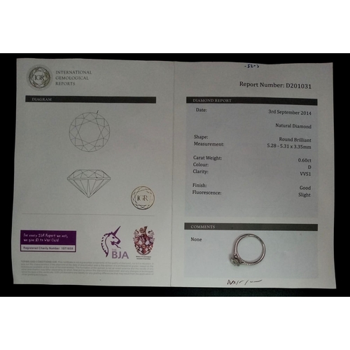 190 - A 950 Platinum Diamond Ring. 0.60ct central round brilliant diamond - D - colour, VVS1. A further 0.... 