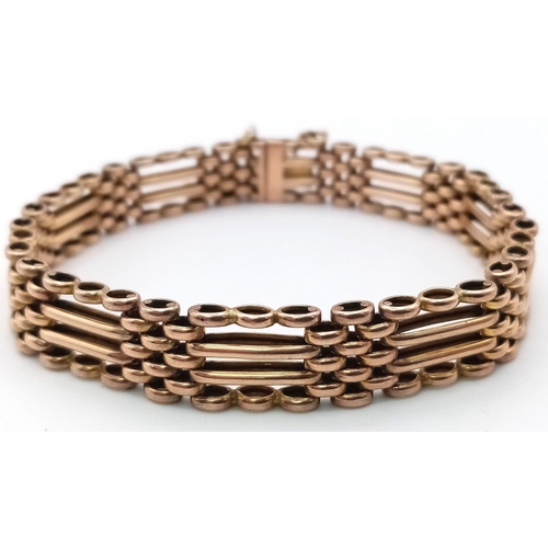 23 - A FOUR ROW VINTAGE SEMI GATE BRACELET IN 9K ROSE GOLD WITH SAFETY CHAIN .17.1gms