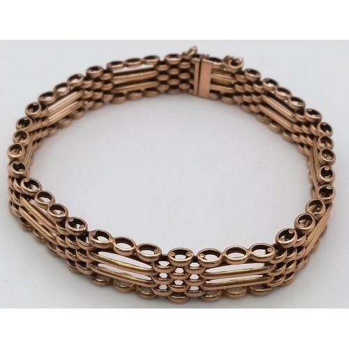 23 - A FOUR ROW VINTAGE SEMI GATE BRACELET IN 9K ROSE GOLD WITH SAFETY CHAIN .17.1gms