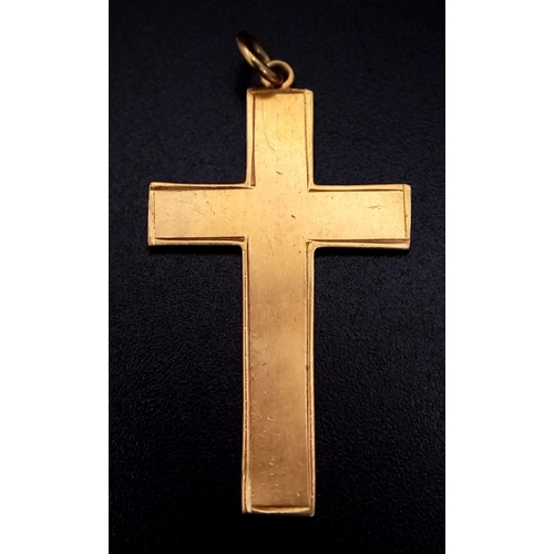 269 - A PLAIN AND TASTEFUL 9K GOLD CROSS . 1.3gms