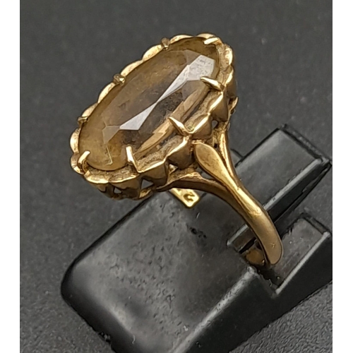 359 - A 9K GOLD DRESS RING WITH MOTTLED CITRINE STONE .  2.9gms   size K