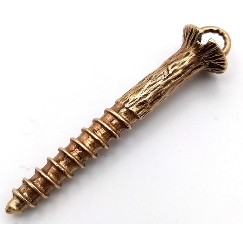 59 - A 9K GOLD PENDANT OR CHARM IN THE SHAPE OF A SCREW .
4.4gms  3.5cms