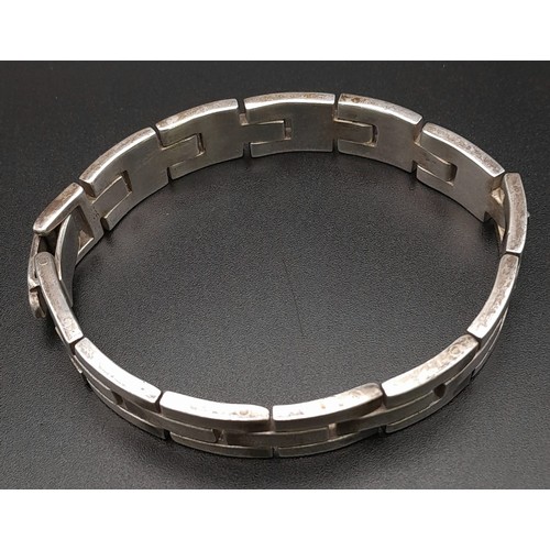 106 - A VERY HEAVY SOLID SILVER BRACELET . 73gms