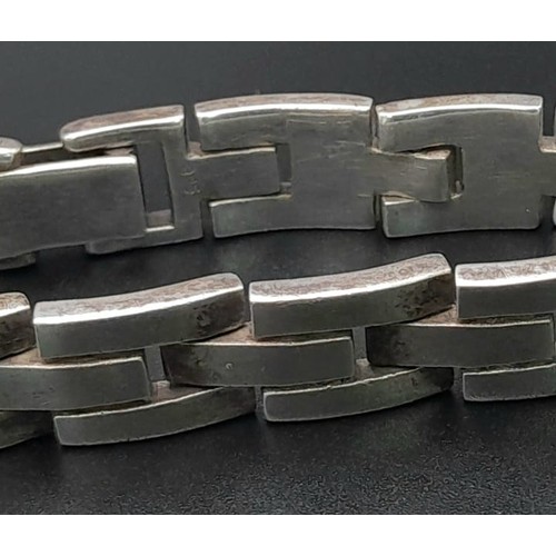 106 - A VERY HEAVY SOLID SILVER BRACELET . 73gms