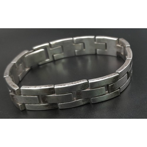 106 - A VERY HEAVY SOLID SILVER BRACELET . 73gms