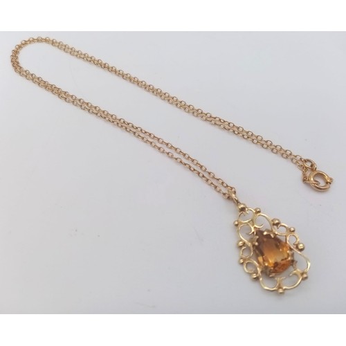 395 - A Citrine and 9K Yellow Gold Pendant on a 9K Yellow Gold Necklace. 2cm and 42cm.