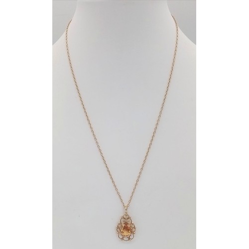 395 - A Citrine and 9K Yellow Gold Pendant on a 9K Yellow Gold Necklace. 2cm and 42cm.