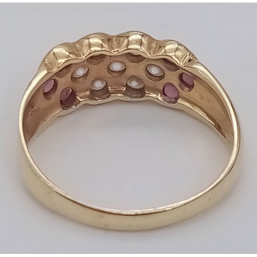 262 - An 18K Yellow Gold Ruby and White Stone Ring. Size R. 4.2g total weight.