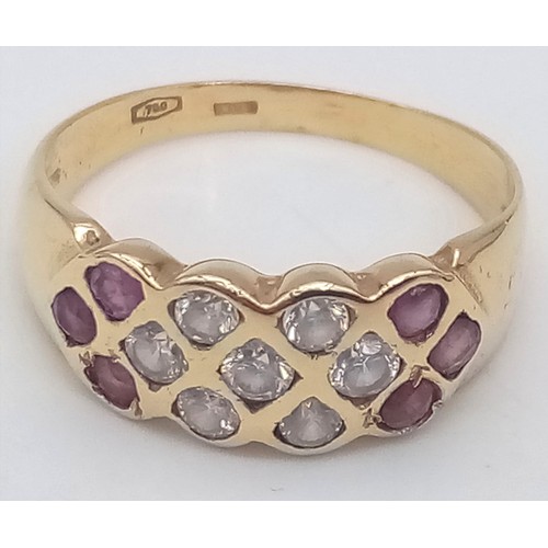 262 - An 18K Yellow Gold Ruby and White Stone Ring. Size R. 4.2g total weight.