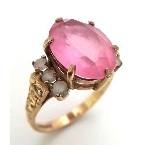 242 - A Vintage 9K Yellow Gold Ring with a Large Pink Central Gemstone. Size N 1/2. 3.95g total weight.