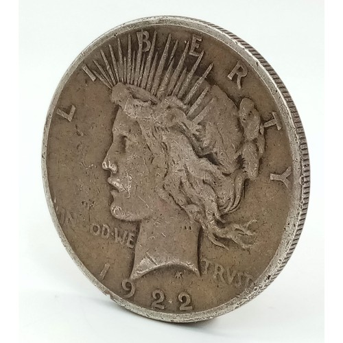 471 - A 1922 Silver one Dollar Coin. Please see photos for condition.