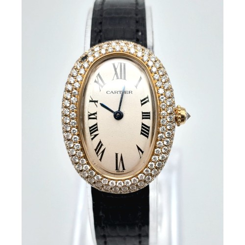 484 - An 18K Gold and Diamond Ladies Cartier Watch. Black leather strap. Gold case - 23mm width with a dia... 