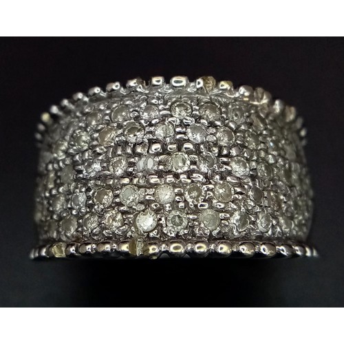 40 - 18K WHITE GOLD DIAMOND SET BAND RING.  0.75CT DIAMOND. TOTAL WEIGHT 10.1G.  SIZE M