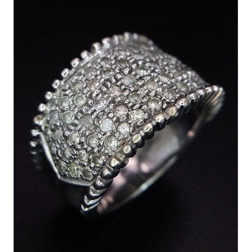 40 - 18K WHITE GOLD DIAMOND SET BAND RING.  0.75CT DIAMOND. TOTAL WEIGHT 10.1G.  SIZE M