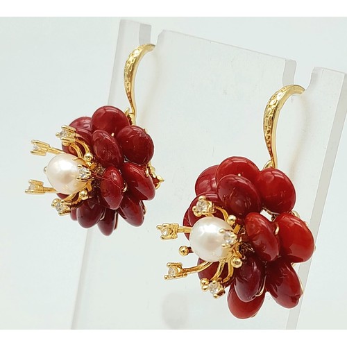 485 - A Pair of Coral and Cultured Pearl Earrings. Set in gilded metal. 25mm diameter.