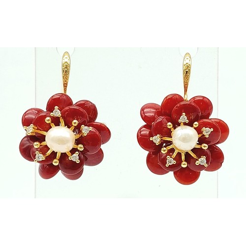 485 - A Pair of Coral and Cultured Pearl Earrings. Set in gilded metal. 25mm diameter.