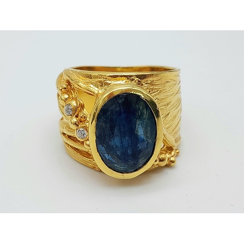 104 - A designer, sterling silver and 18 K yellow gold ring with a large, oval cut natural kyanite. Presen... 