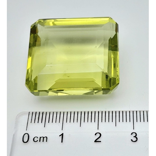 153 - A very desirable, large (76.8 carats) peridot. Emerald cut, with excellent colour uniformity and sat... 