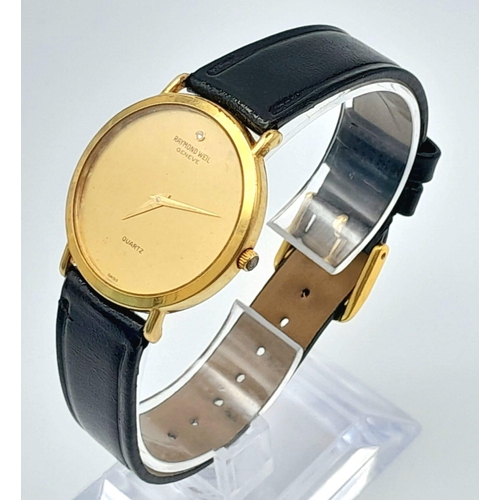 400 - A Classic Raymond Weil Geneve Gold Plated Quartz Gents Watch. Black leather strap. Gold plated case ... 