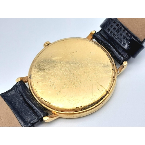 400 - A Classic Raymond Weil Geneve Gold Plated Quartz Gents Watch. Black leather strap. Gold plated case ... 