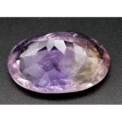 412 - A 23.18ct Faceted Ametrine in Oval Shape come with IGL&I Certification.