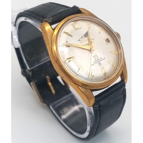 324 - A Rare Garuda Jetmaster Gents Watch. Black leather strap. Gilded stainless steel case - 34mm. Silver... 