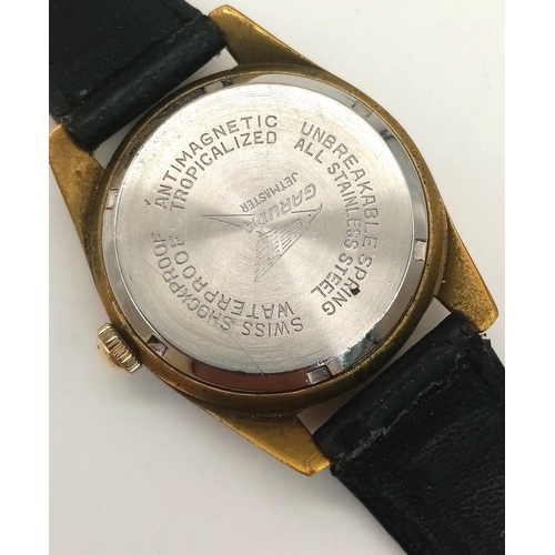 324 - A Rare Garuda Jetmaster Gents Watch. Black leather strap. Gilded stainless steel case - 34mm. Silver... 