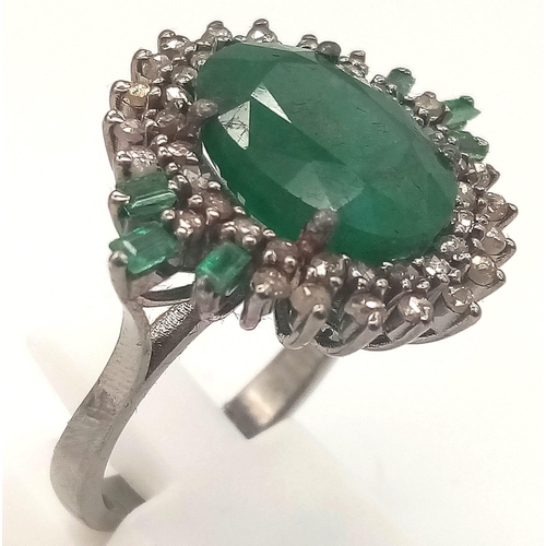 449 - A 6.10ct Emerald Ring with 0.83ct Diamond Accents on 925 Silver. Ring Size P, Total Weight 7.70 gram... 