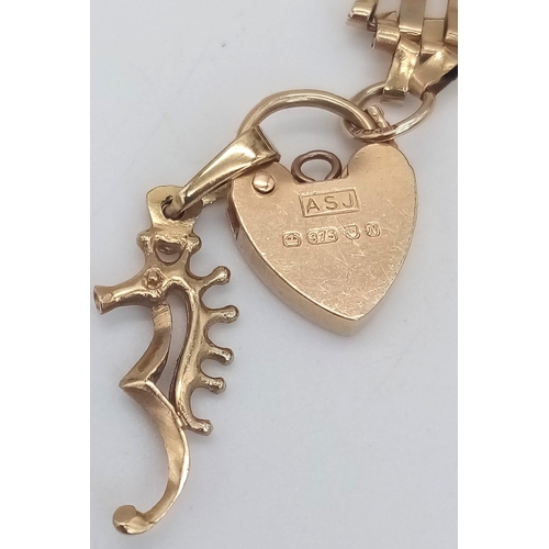 48 - A Vintage 9K Yellow Gold Gate Bracelet with Heart Clasp and Seahorse Charm. 18cm. 5.2g